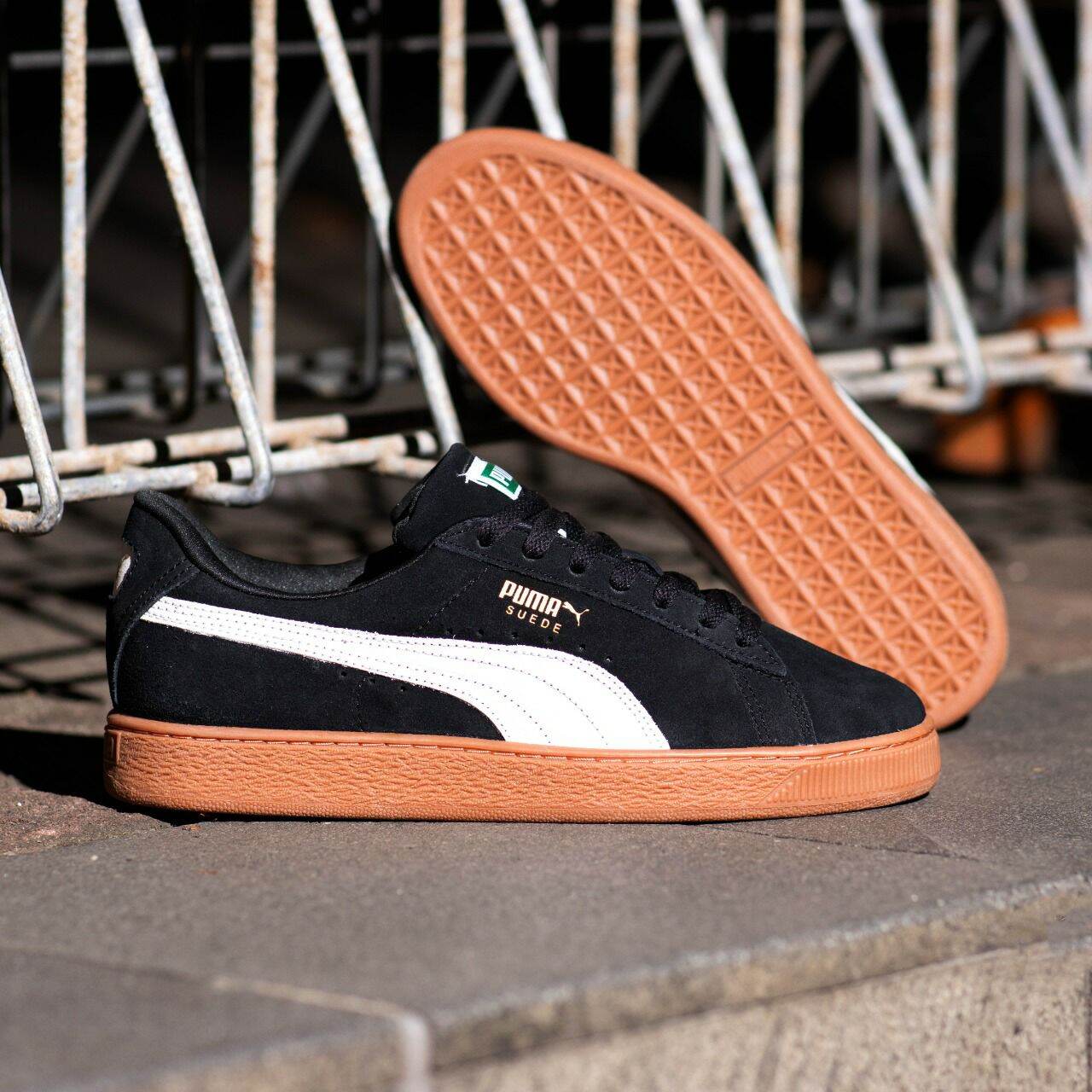 black suede pumas with gum sole