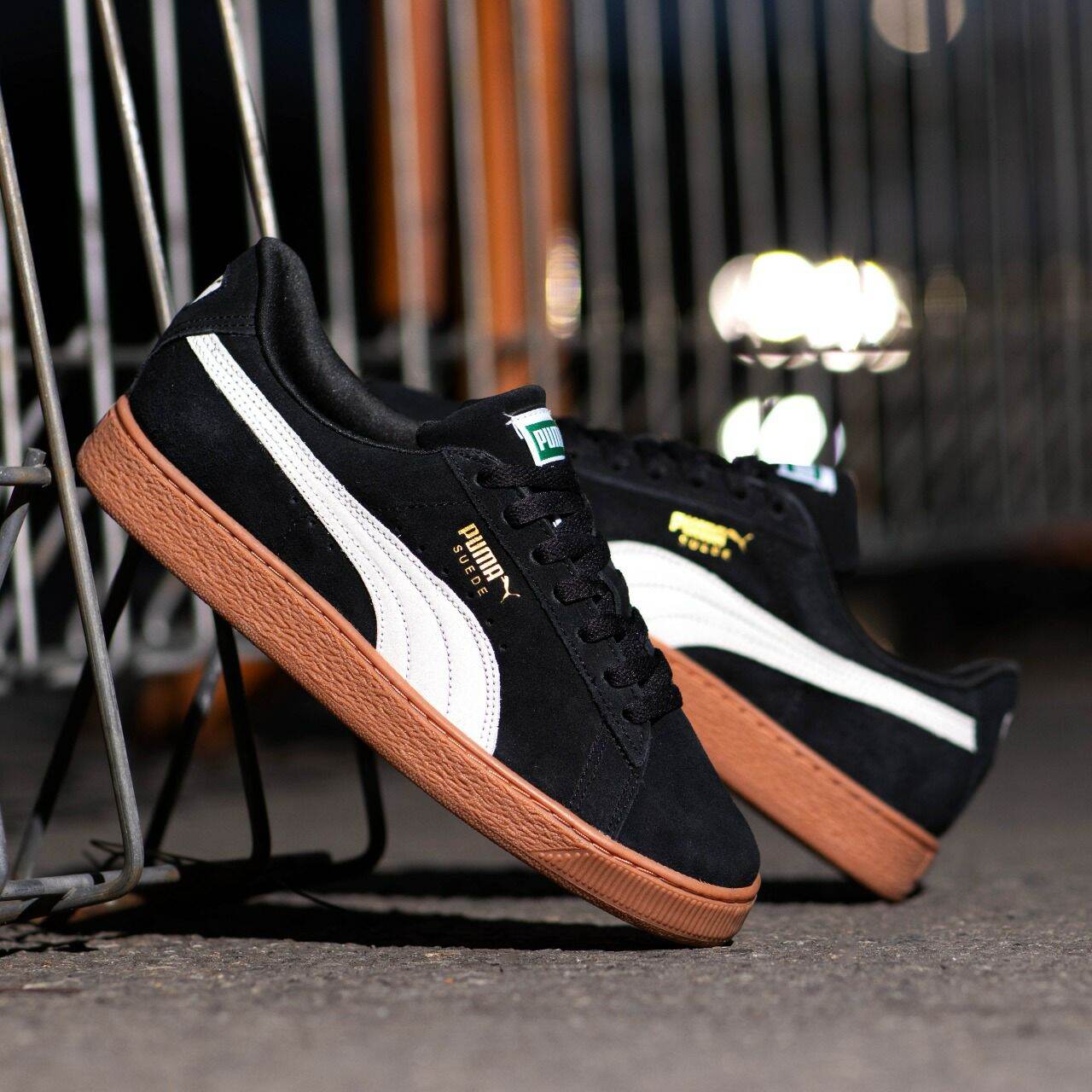 black suede pumas with gum sole